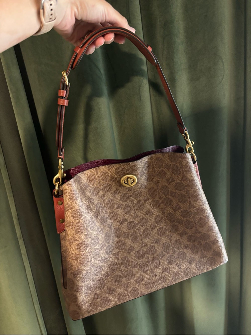 Coach Willow Bucket Bag in Signature Canvas with a turnlock closure